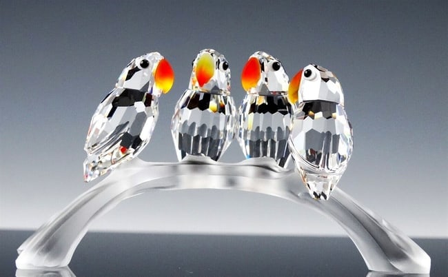 Swarovski Birds (2): Parrots and Baby birds. Swarovski. 1 3/4” H x 3 1/4”W and baby 1 1/2”H x 3”W