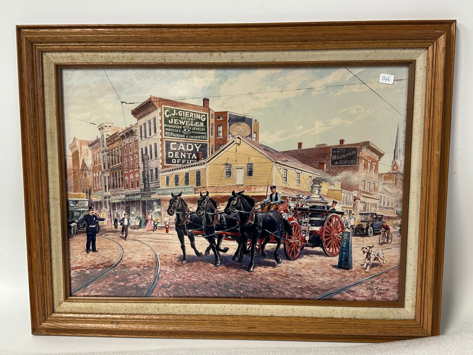 John F. Gould Early Middletown NY Print: Signed lower right in the plate John F Gould in script and in print, C. 1990 Depicts early Middletown NY Main Street inc. Giering Jewelry; White Mountain Bakery and Cady Dental Offices With horse draw