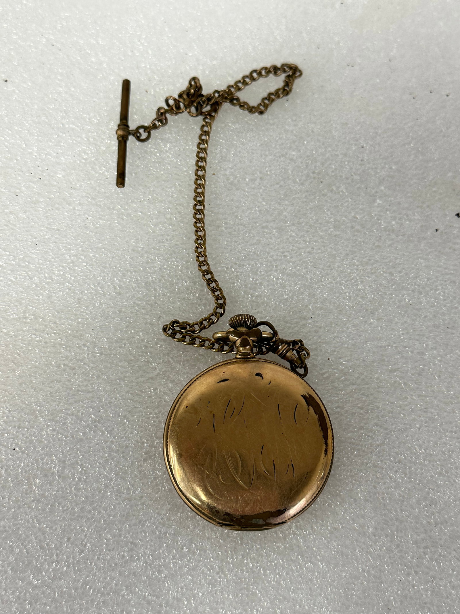 Antique Waltham Closed Case Pocket Watch: Marked Waltham on the dial. Ornate script monogram. With chain