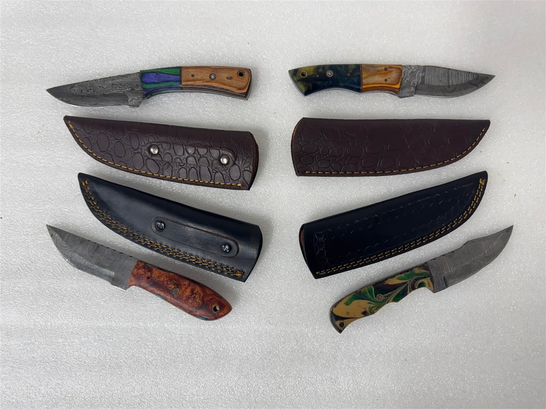 Damascus Steel Knives in Sheaths (4): All different. Varying sizes. Custom made. Four in the lot. As pictured