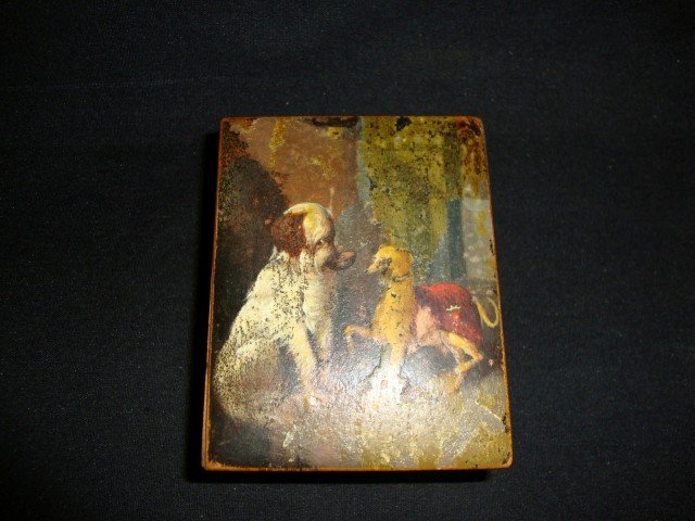 18th-19th C. Lacquered watch Case: With hand painted dog decorations at the top, the box opens to reveal a carved out watch or locket holder which raises up on an easel back for night time display; 1.75in. H. x 3.25in. W. x 4in. D. Ple