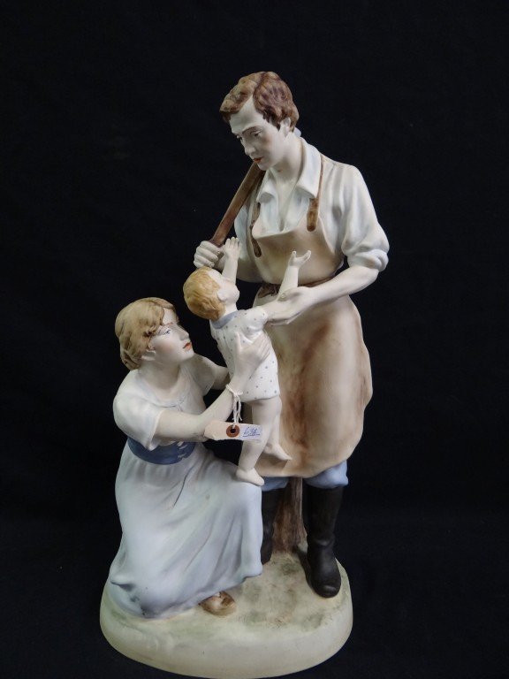 Royal Dux porcelain grouping: Hand painted porcelain grouping. Mother, father and child. Marked at bottom; 25in. H. (as is with age lines)