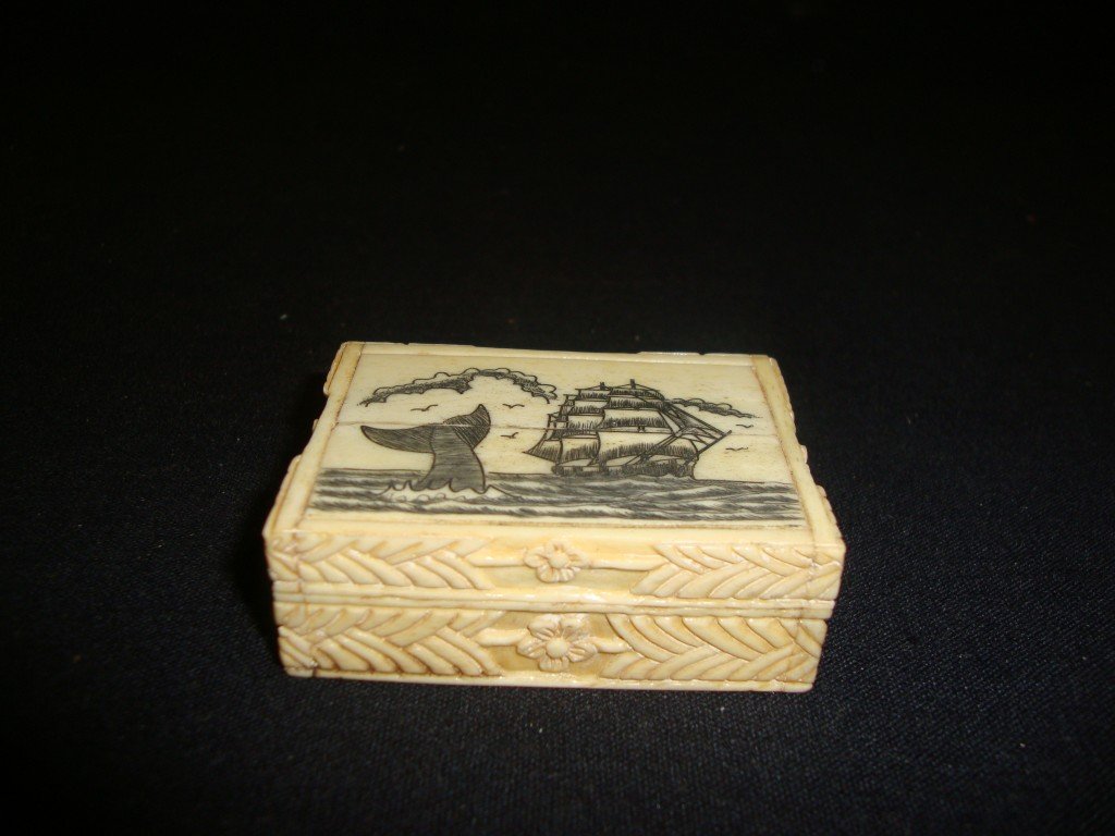 Ivory Nautical Gambling Box: Scrimshawed whale and clipper ship decorations at the top with six dice at the inside.