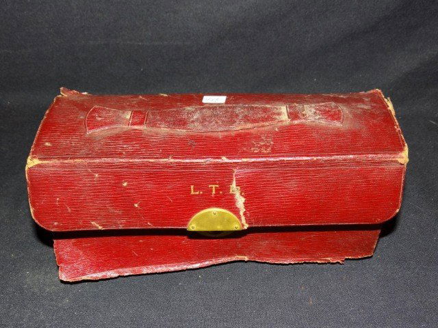 Early leather case first aid kit: Leather cased first aid kit with fitted interior. Eight(8) glass bottles, etc.; 4.5in. H. x 9.5in. W.