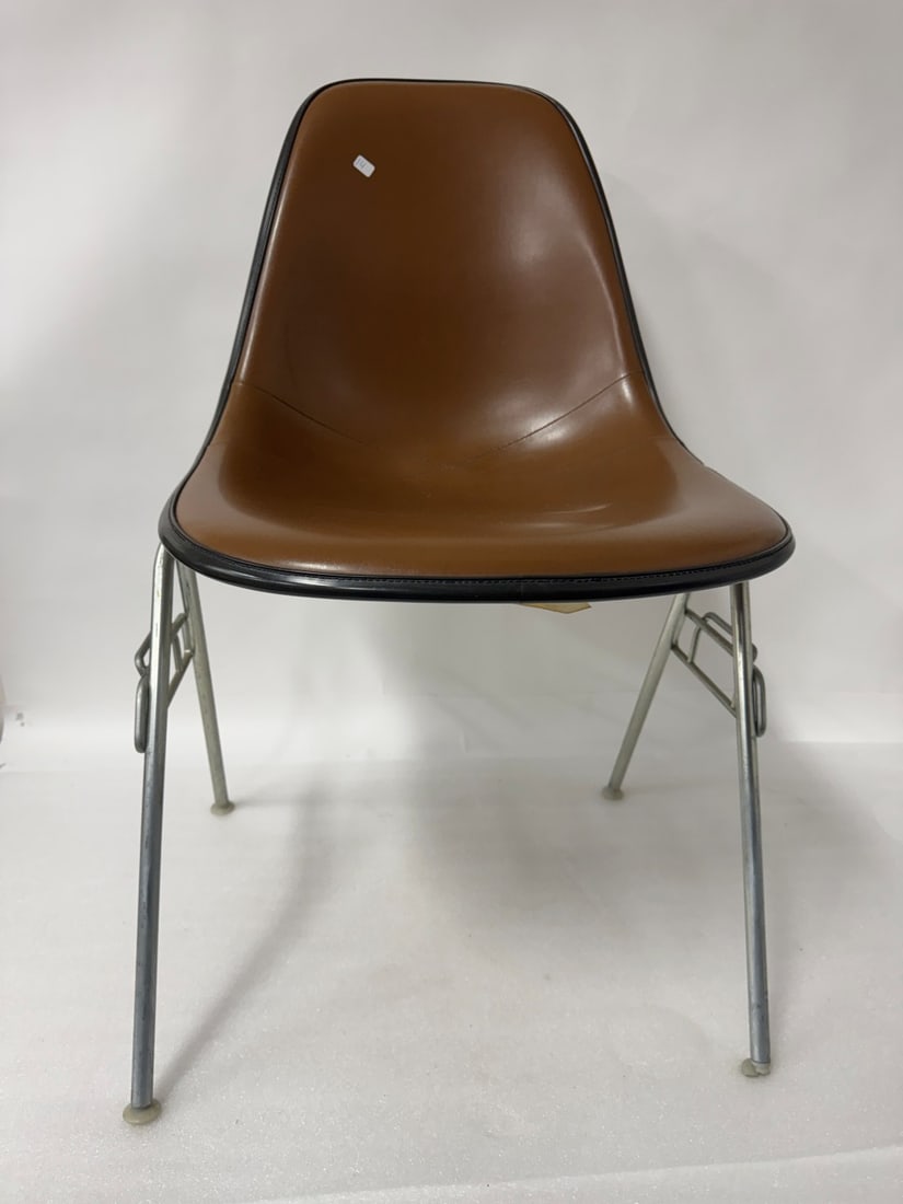 MCM Herman Miller Chair: Single Orange-Black frontispiece.Brown seat. About 30.5"H by 18.5"W.