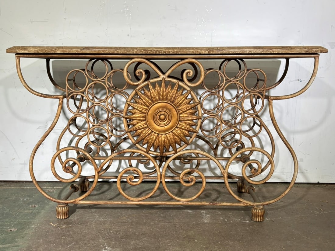 Magnificent Spanish Revival Bar Console: Ornate gilt scrolling bar console. Central sunburst appliqu?. Inlaid two-tone beveled faux marble top. Having double wine rack insets; 34in.H. X 58in.W. X 20in.D.