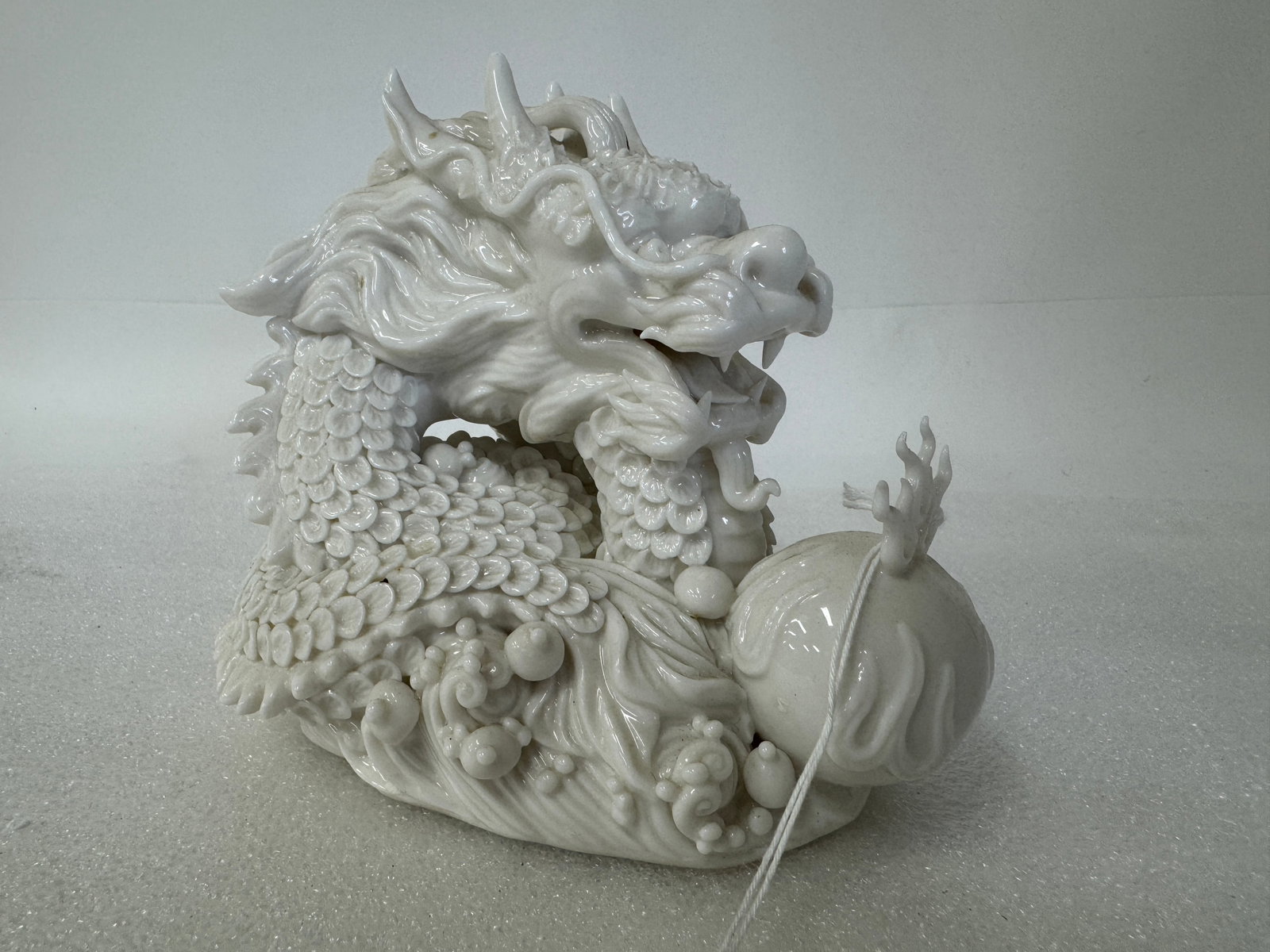 Milk Glass Over Porcelain Dragon: Very detailed. Excellent conditon 6"H x 6"W