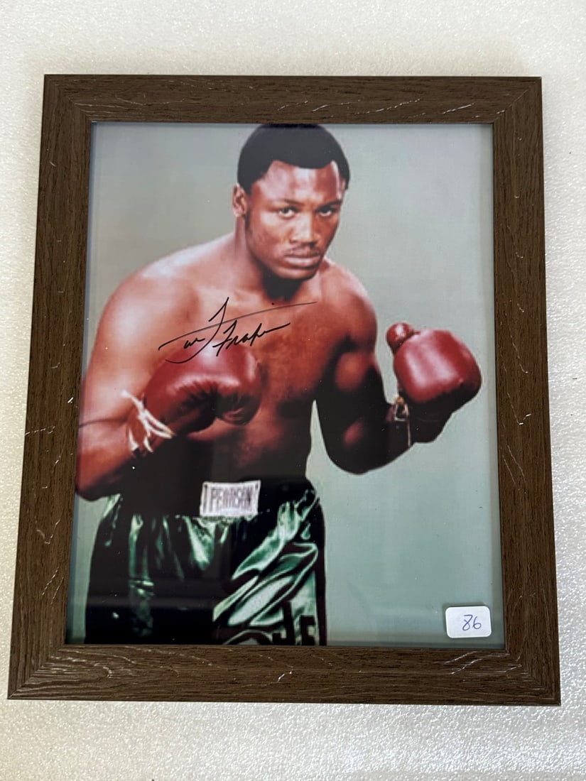 Joe Frazier Sgd. Photograph with COA: 8 x 10. Framed. With certificate of authenticity