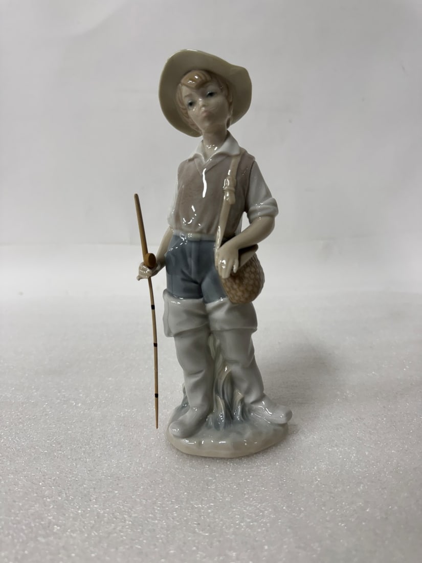 Lladro Figure Going Fishing: Sgd at the underside. 1972 Retired 2001 8 1/2"H Spanish name: Nino Pascador