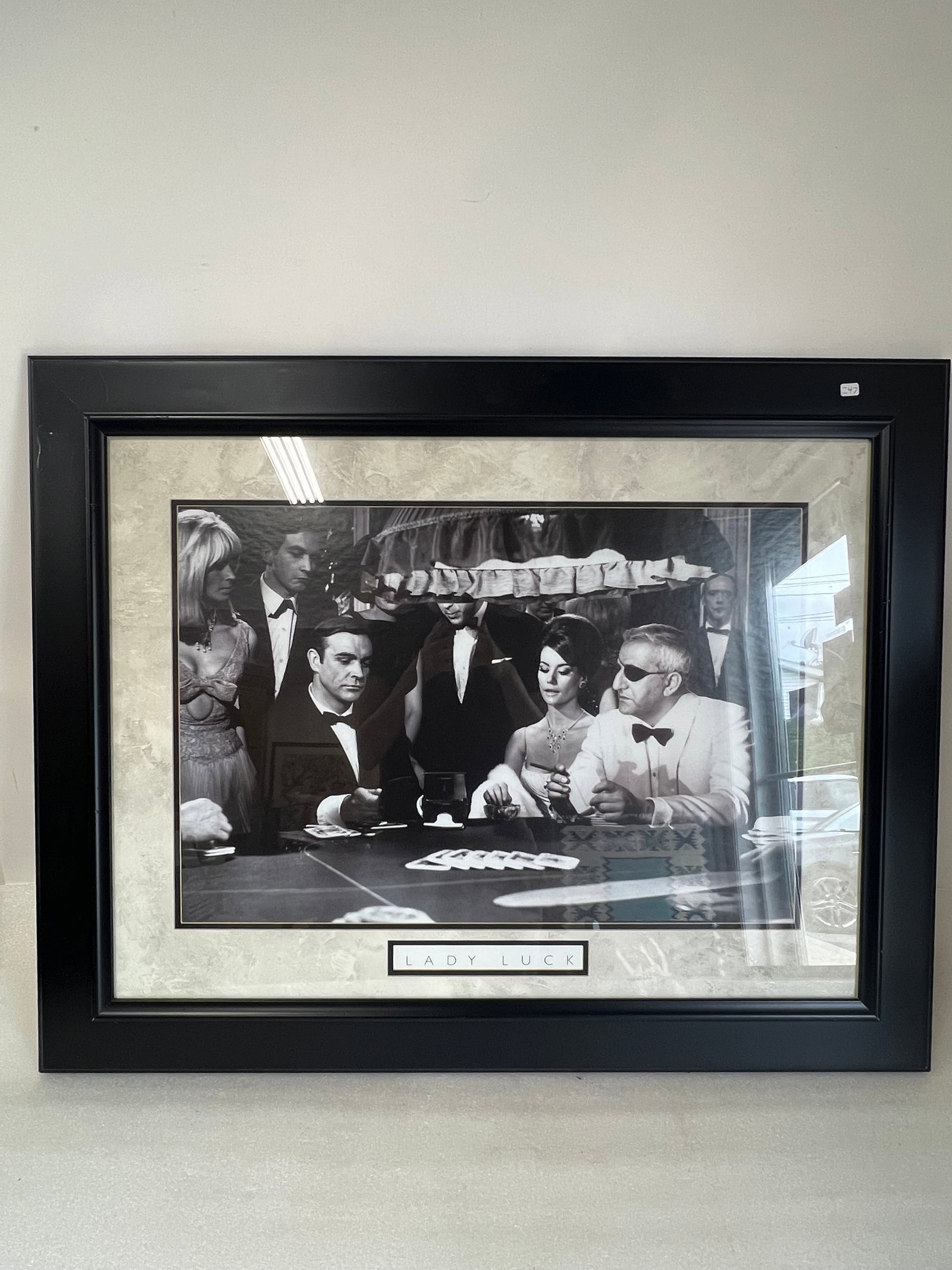 Lady Luck GamblingPhotograph: Matted and framed. James Bond perhaps with Natalie Wood. 30 1/2"H x 38"W