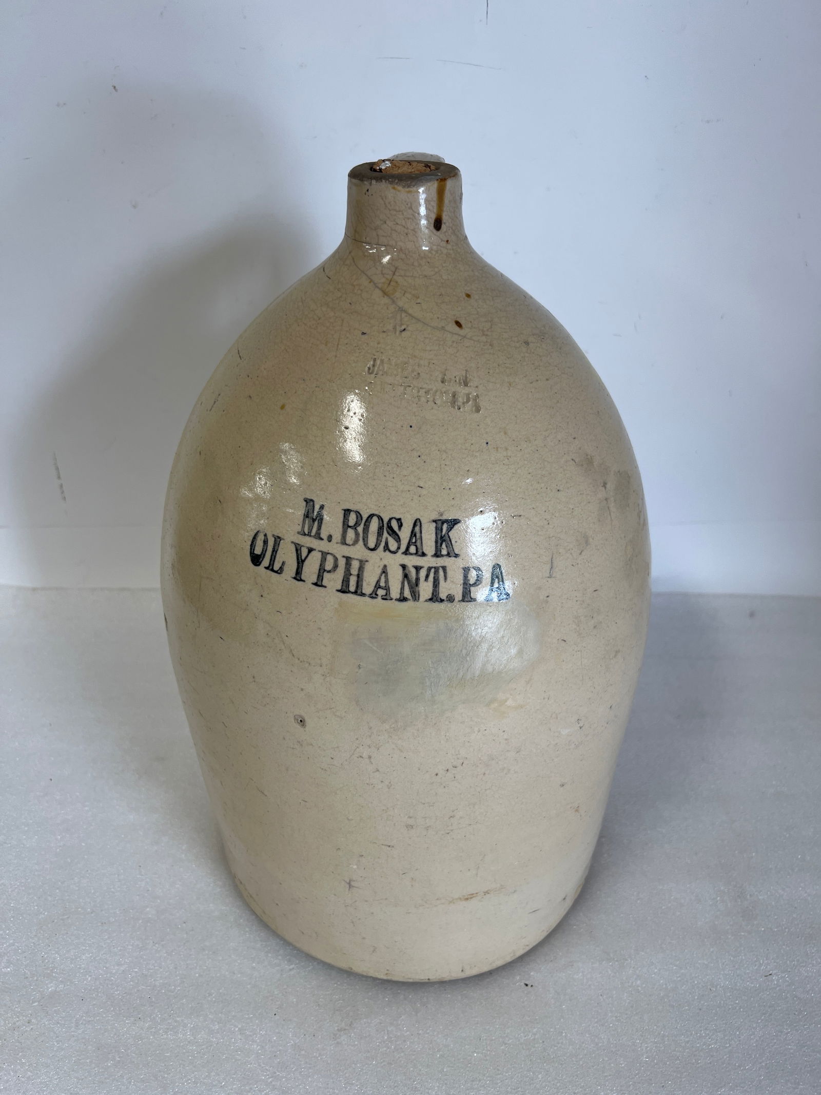 Antique Stoneware Crock: Marked at the front M. Bosak. Olyphant, Pa. 5 Gallon jug. 17 1/2"H