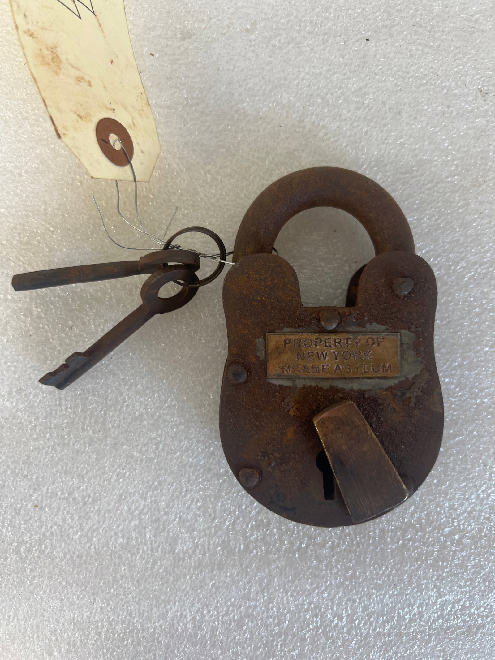 Cast Iron Lock. Property of New York Insane Asylum: Very heavy cast iron lock and key Applied brass plaque reads New York Insane Asylum
