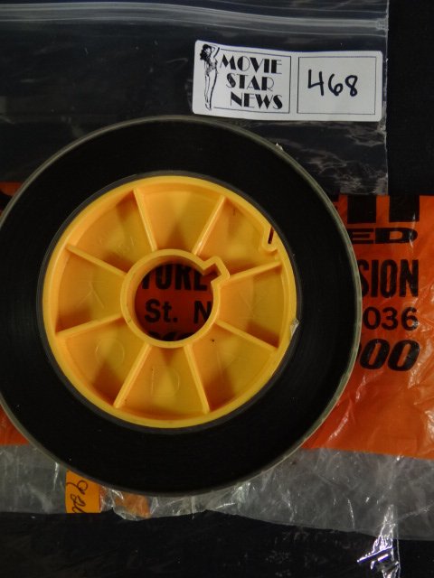 Original Irving Klaw Negatives and Master Reels: Black and white. Head Scissor Fight by Chris and Jackie starring Chris Dimes (dark) and Jackie Lens (light). 16mm, 150 feet. 3/4" on large core.