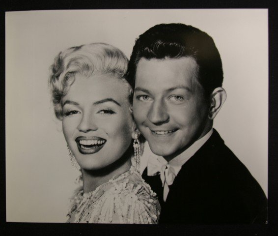 Marilyn Monroe Publicity Photographs (9): Black and White. With Donald O'Connor (2); With Tony Randall (1). Included in the lot are several stills with Yves Montand; publicity still of Marilyn; and a scene with Tony Curtis. 8 x 10-1/4 to 7-1/