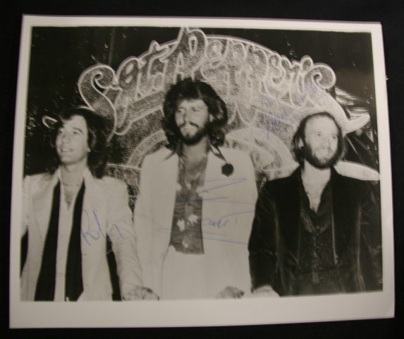 Bee Gees Signed Photograph: Signed in ink, "Barry Gibb, Robin Gibb, and Maurice Gibb"
