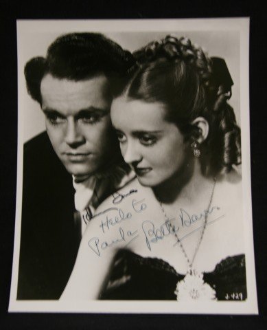 Henry Fonda and Bette Davis Signed Photograph: Signed in black ink, "Henry Fonda"; signed in ink, "Hello to Paula (Klaw), Bette Davis" 8x10