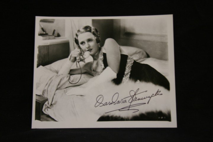 Stanwyck, Preston and McCrea Signed Photograph: Signed in black in by Barabra Stanwyck, Robert Preston and Joel McCrea. 8x10