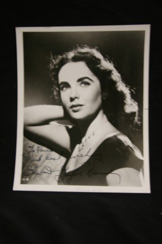 Elizabeth Taylor Signed Photograph: Signed in ink, "To Paula (Klaw) with best wishes, Elizabeth Taylor Warner" Warner was in reference to Senator John Warner, Elizabeth Taylor's sixth husband. 8x10