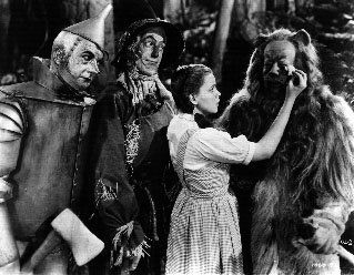 The Wizard of Oz Negative: Black and white. The Tin Man and The Scarecrow watch as Dorothy wipes tears from the face of The Cowardly Lion. Included in the lot is a print made from the negative. 8 x 10