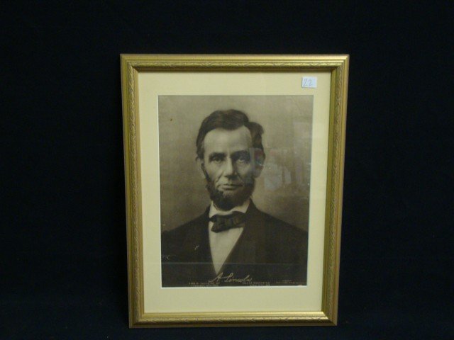 Abraham Lincoln Photograph: Matted and gallery framed photo of President Abraham Lincoln. 12 1/2" x 9 1/4", overall 17 3/4" x 13 5/8"/ Verso states that this photo was taken by famous Civil War photographer, Matthew Brady, and t
