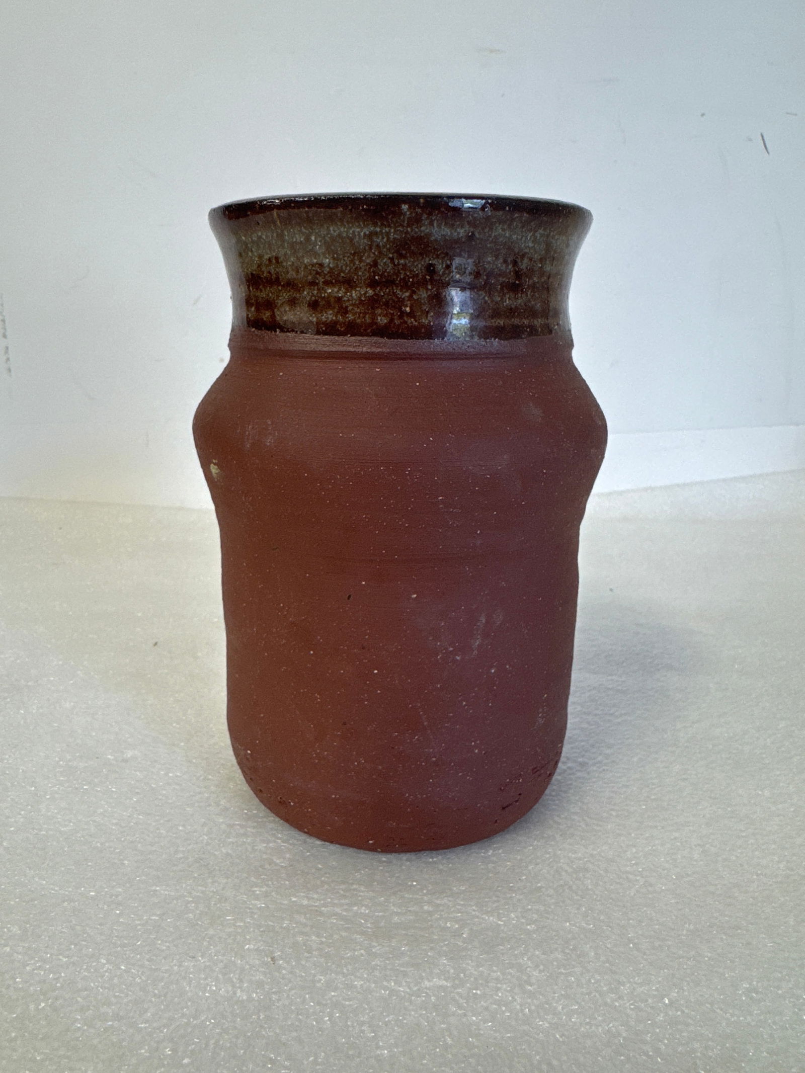 Antique Redware Pottery Vase: With a high glaze variegated outside rim band which extends itself down through the interior of the vase. 7 3/4"H