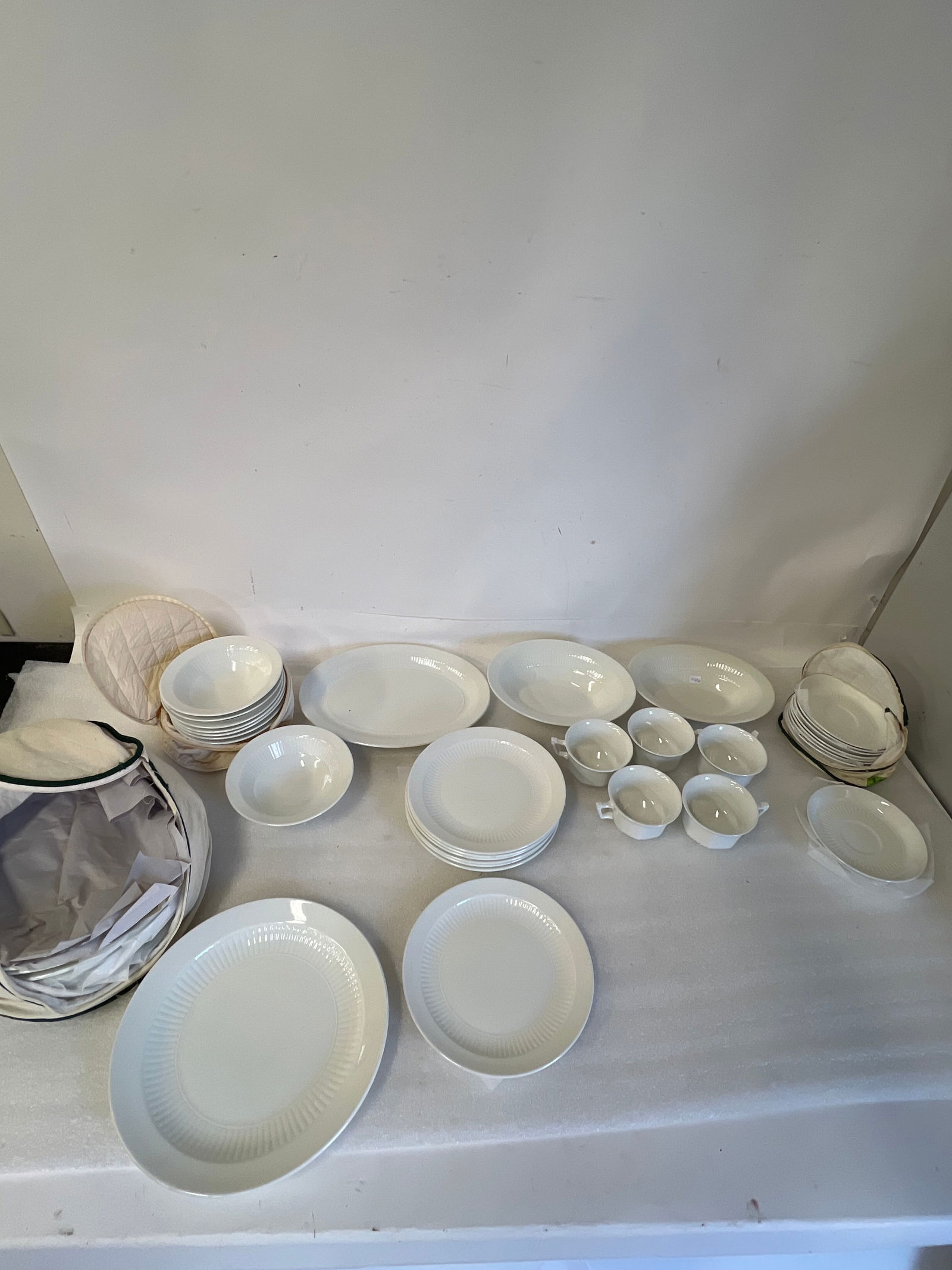 Adams Wedgwood English Ironstone China. (38 pcs. ): Five cups, 8 soup bowls 6 1/2", 8 saucers 6"W, 6 dinner plates 10"D , two serving bowls, one platter and 8 other plates, 8"D Thirty-eight pcs in the lot.