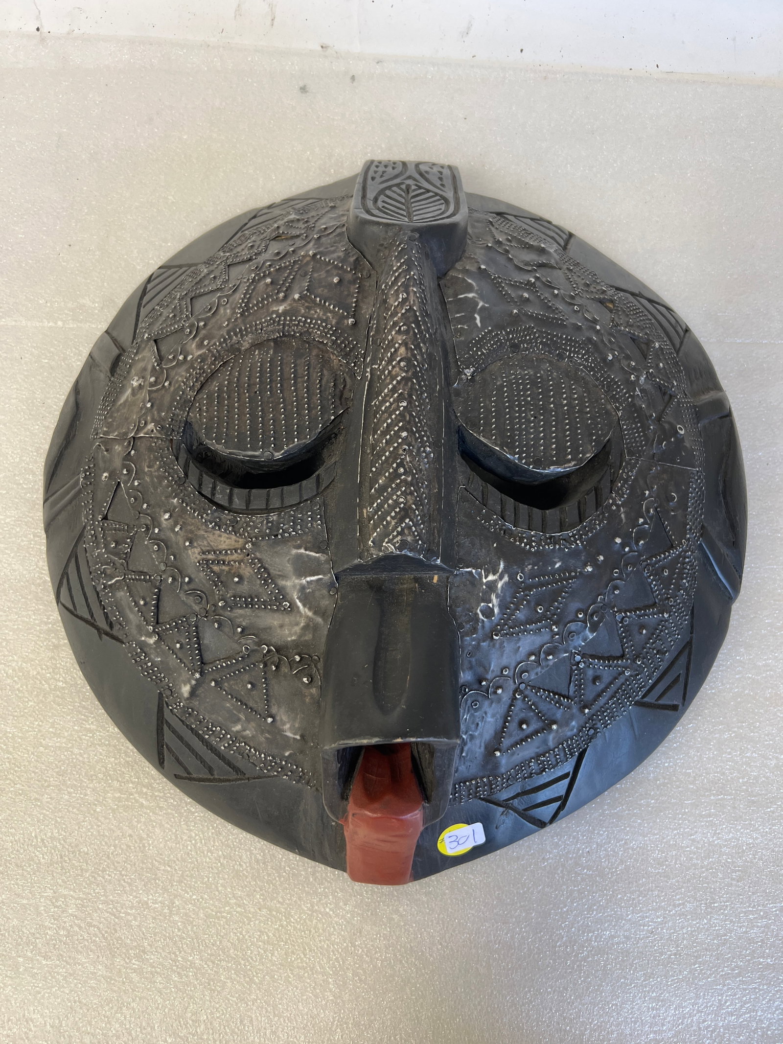 Vintage African Tribal Mask: With metal applications and embellishments throughout. 16" x 18" H, The face with intricate design