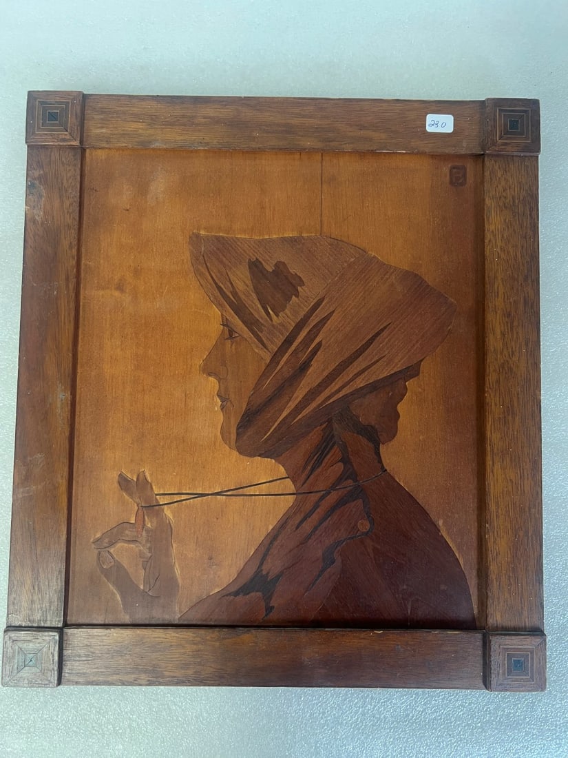Antique Inlaid Wooden Plaque A Woman: Self Framed.16"H x 14"W Indiscernible monogram upper right, Label at the back for A Bernard Co. Fifth Ave. NYC and a written label only partial and indiscernible.