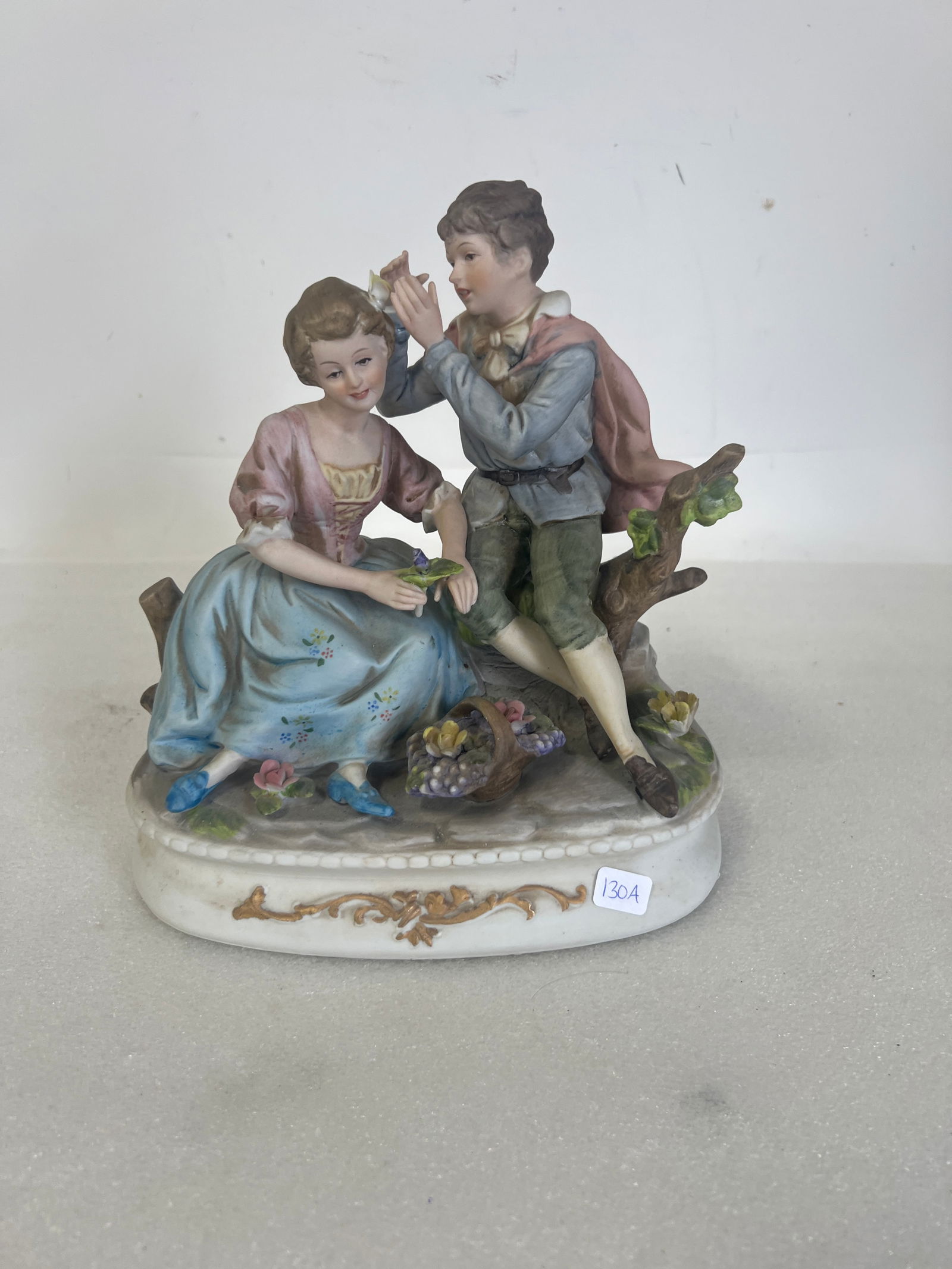 Italian Bisque Figure of a Couplle: Marked Italy. 9 1/2"H x 8 1/2"W