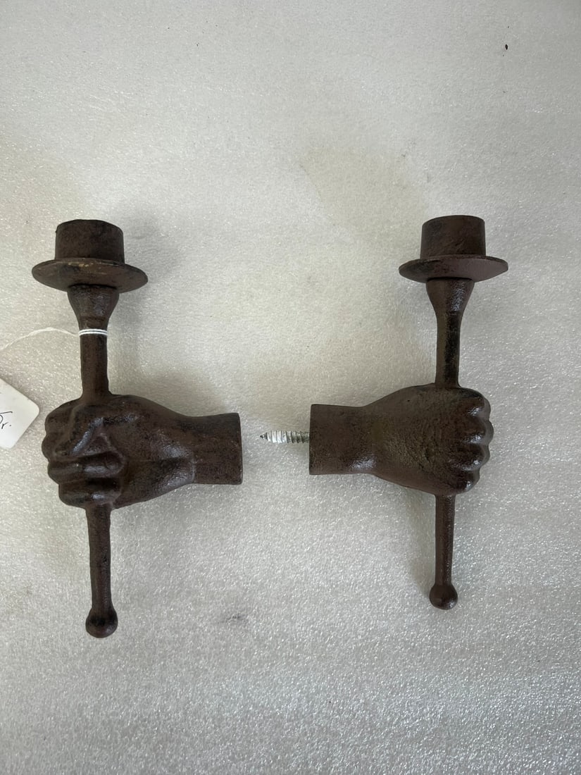 Cast Iron 19th C. Hand Candlesticks: Cast Iron ands holding candlestick. With opening at wrist for mounting.