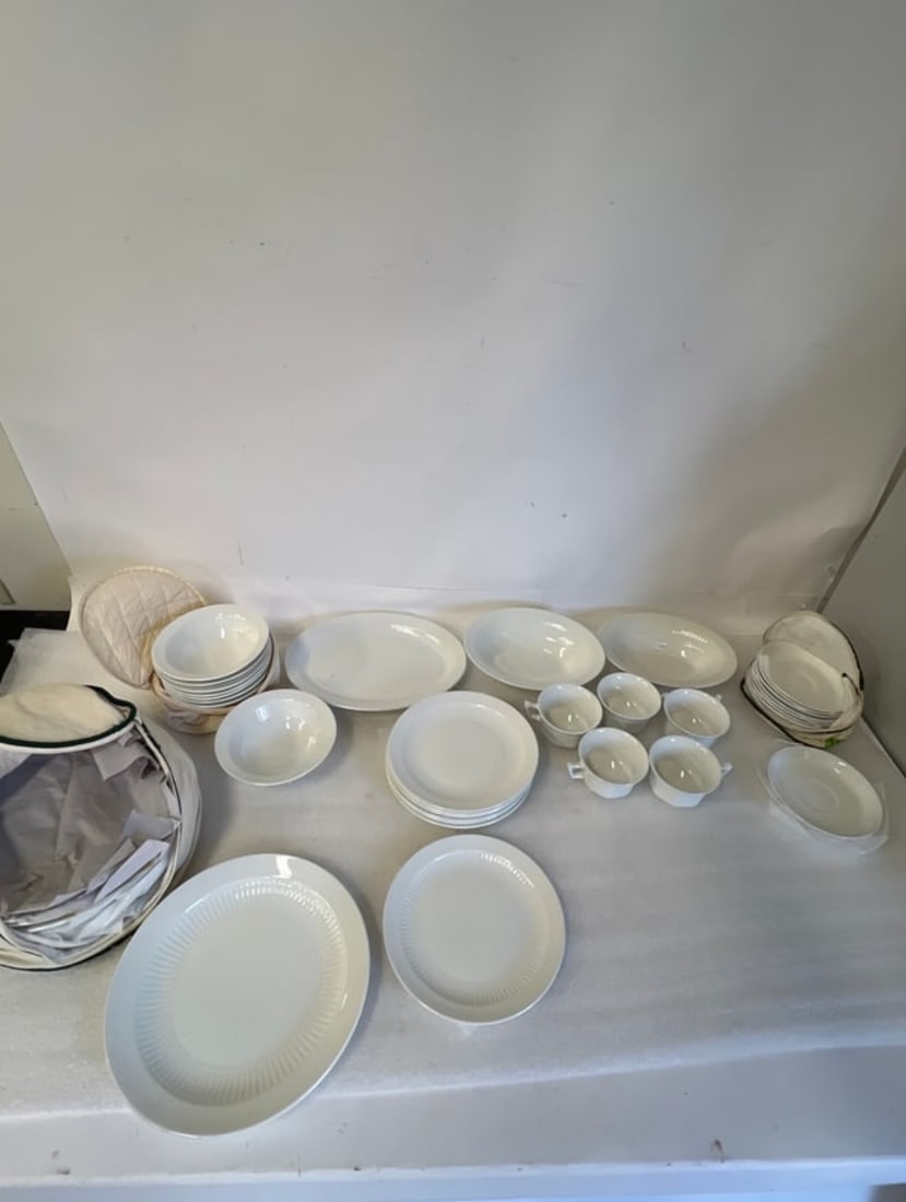 Adams Wedgwood English Ironstone China. (38 pcs. ): Five cups, 8 soup bowls 6 1/2", 8 saucers 6"W, 6 dinner plates 10"D , two serving bowls, one platter and 8 other plates, 8"D Thirty-eight pcs in the lot.