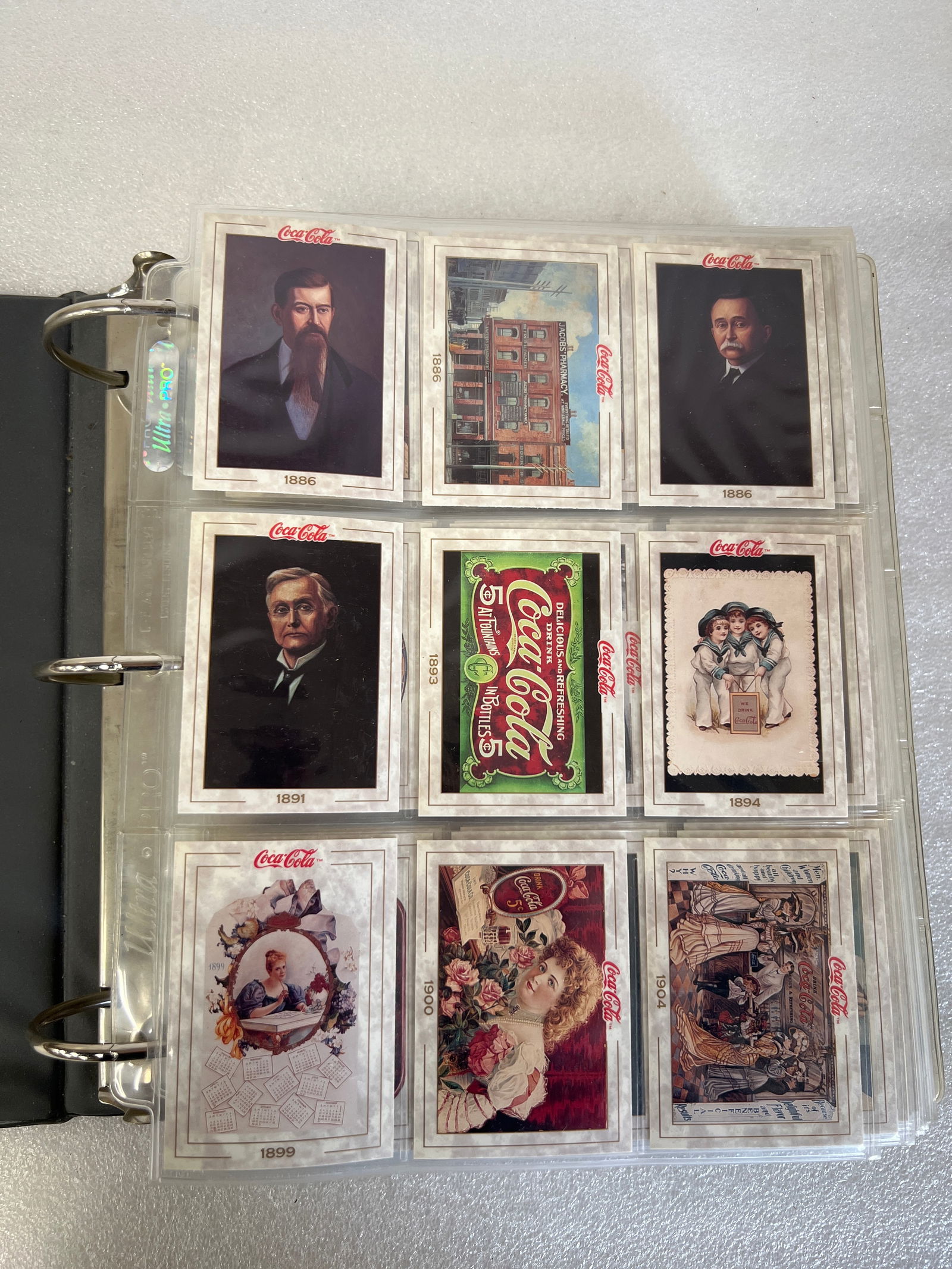 Superb Collection of Coca Cola Postcards. (Approx 600): Featuring original artwork from the 1940' In an album with nine to a page. Under protective holders. Approx. 600 in all. Excellent condition