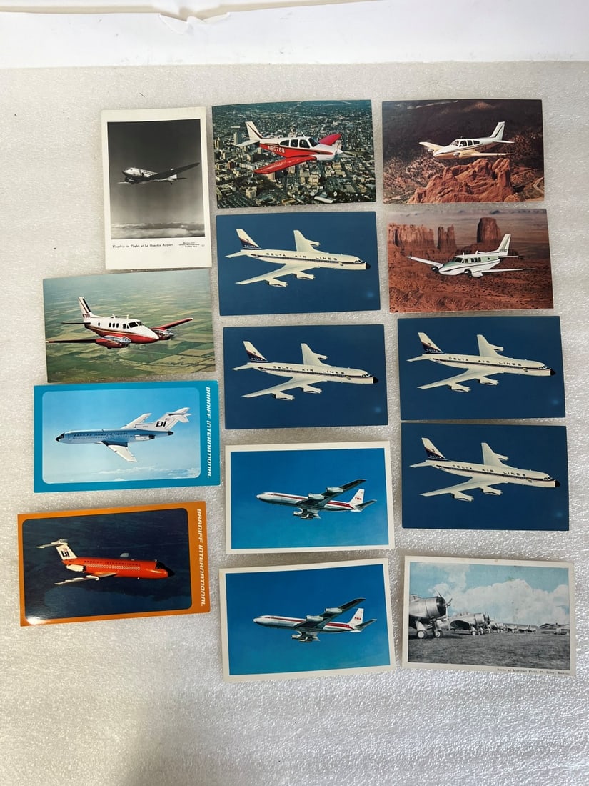 Vintage Airplane Postcards (14): Trans World (2) Delta (4) Beechcraft (3) Braniff (2) Turboprop Beechcraft (1) Flagship in Flight (1) written on and sent; and a scene at Mashall Field, Ft Riley, Kansas. Fourteen in the lot