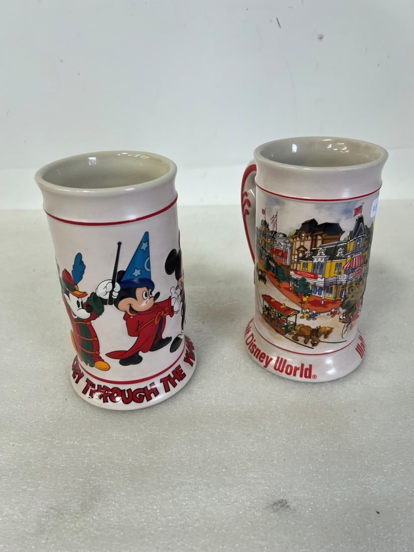 Ceramartre Brazilian Disne y Mugs (2): Both marked Disney at the underside and one with a Ceramartre label as well . One depicts Walt Disney World and one Mickey Through the Years. Both 7"H