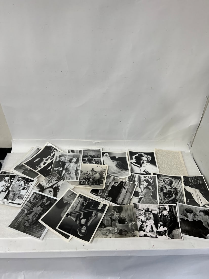 Bette Davis Movie Photos (25): All black and white. Mostly 8 x 10 Includes printed list of her movies, the scenes depicted in the photographs, the year, the co-stars etc.