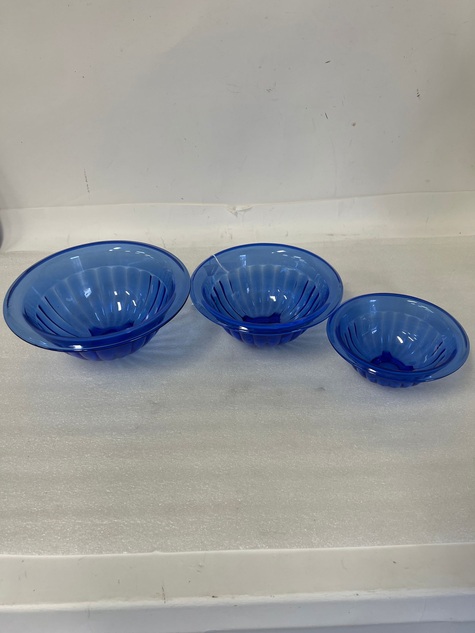 Blue Glass Bowls (3): Largest 4 1/2" H by 11" W Smallest 3 1/2" H 7 1/2" W