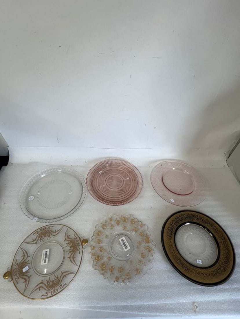 Collectible Good Quality Platters (6): Gilt flowers, pink depression . gilt decorated double handled tray, fancy gilt border and black rimmed platter, , pink depression platter and clear platter. 12 3/4"D to 10 1/4" Six antique glass platt