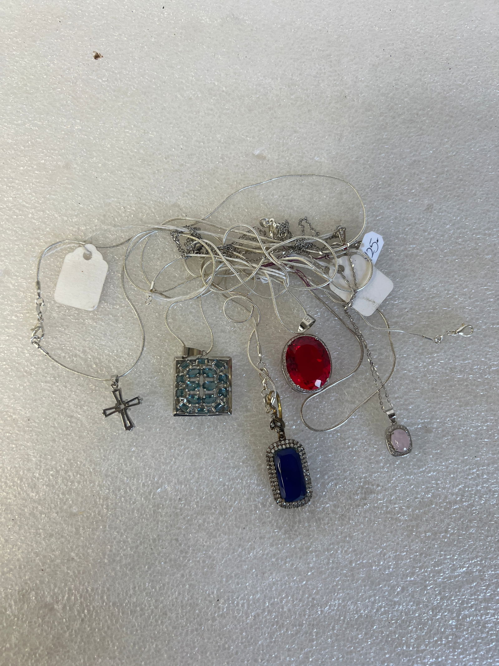 Sterling Silver Necklaces (6): Three are sterling silver pendants on sterling silver chains, one with red faceted stone; one with blue faceted stone; one with openwork aquamarines; three with sterling silver chains, one is a pink q