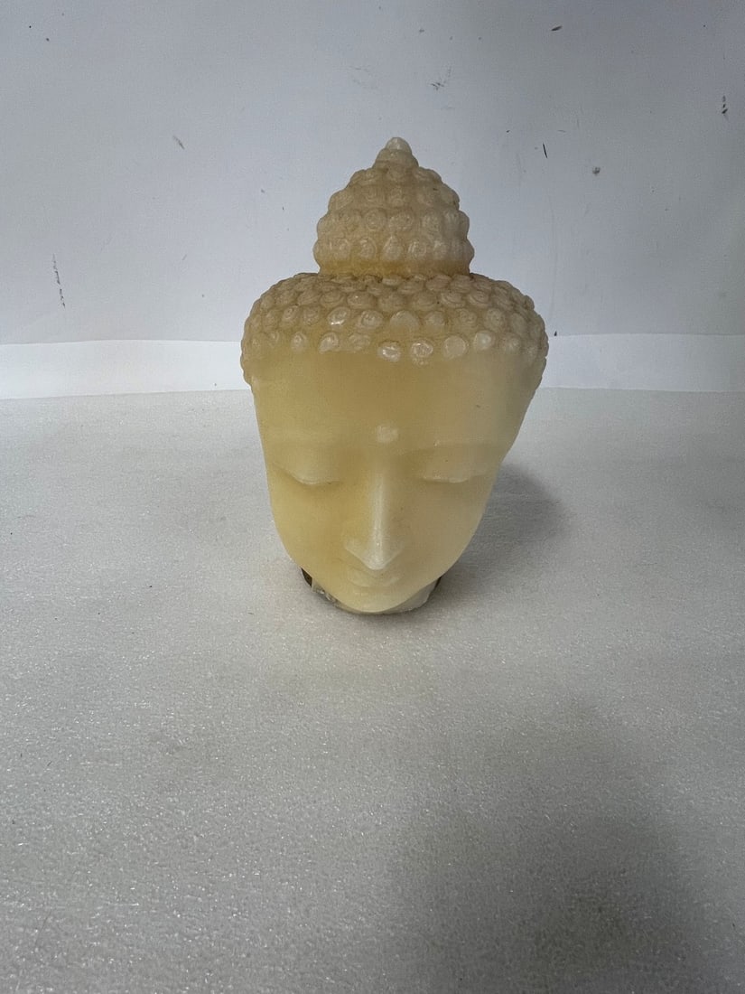 Orential Buddha Head Candle: 9" H by 6 1/2" W Sticker on the Bottom that shows info about Candle