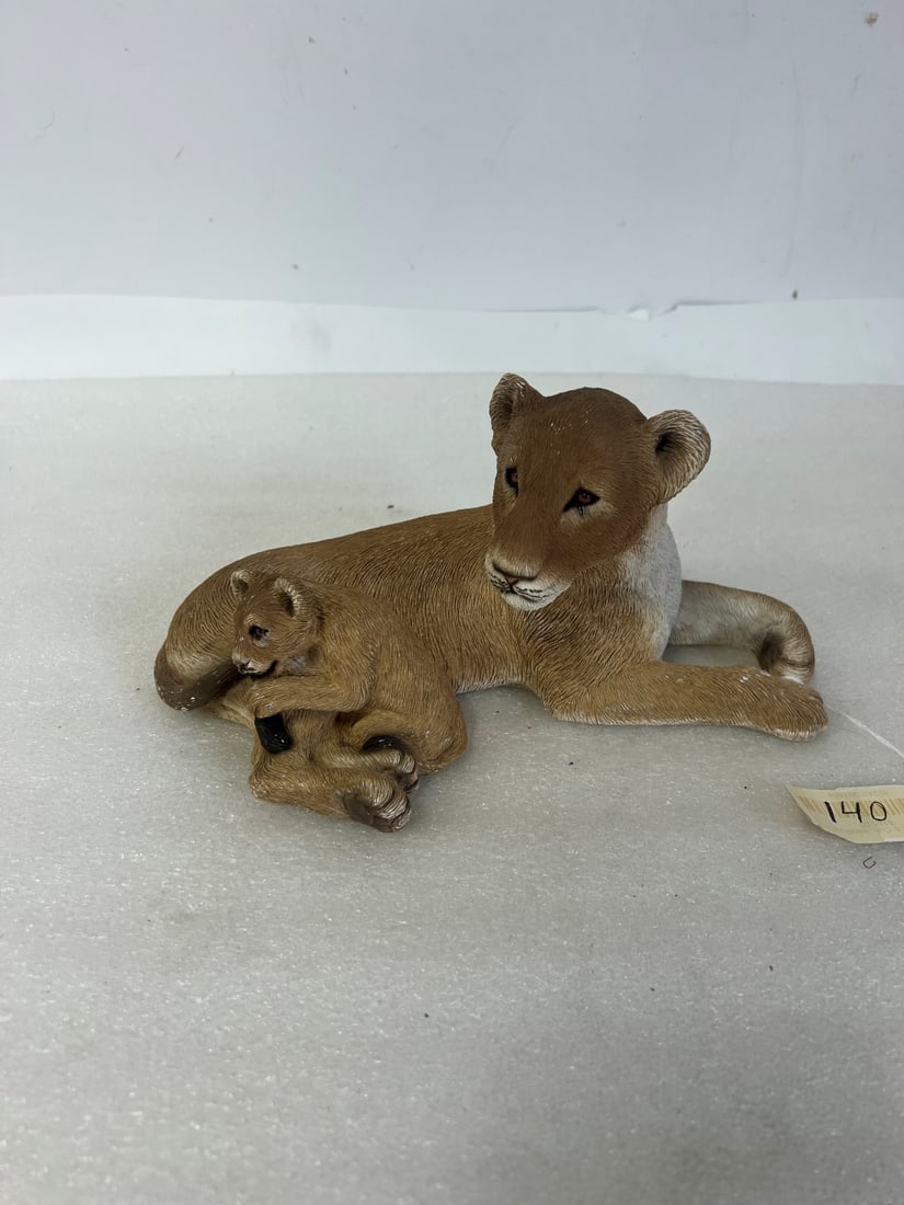 Sandcast Figure of a Lioiness and Cub: Marked at the underside with artist name 10"L