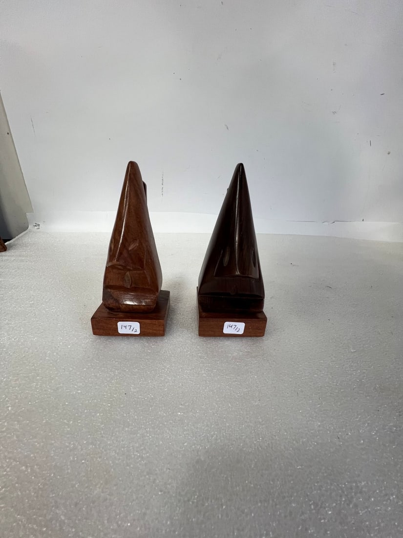 Carved Wooden Figural Bookends (2): 6'H. Varying color.