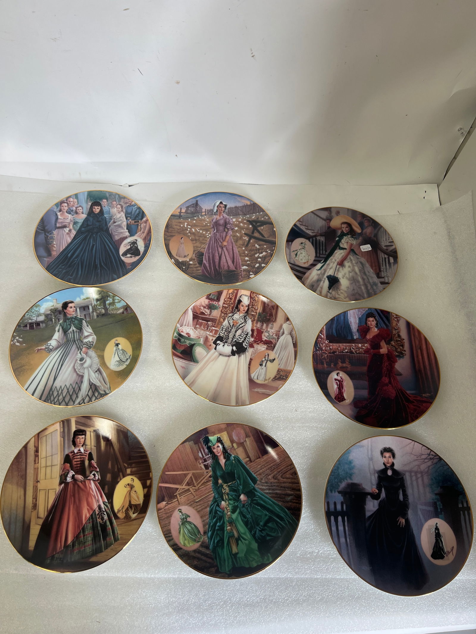 Bradford 1994 Gone with The Wind Plates (9): All plates are 8.25” im diameter. Lot includes: “Paid Business Attire”, “The Country Walking Dress”, “Widows Weeds”, “The Green Drapery Dress”, “The Mourning