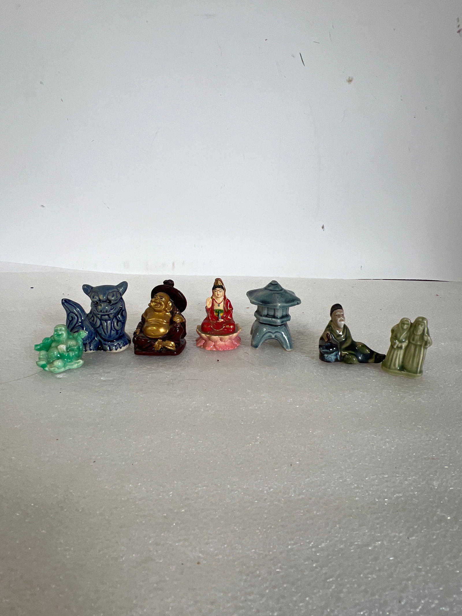 Antique Oriental Figures (7): 2”H to 1.25”H. Pottery, Porcelain 7 in the lot