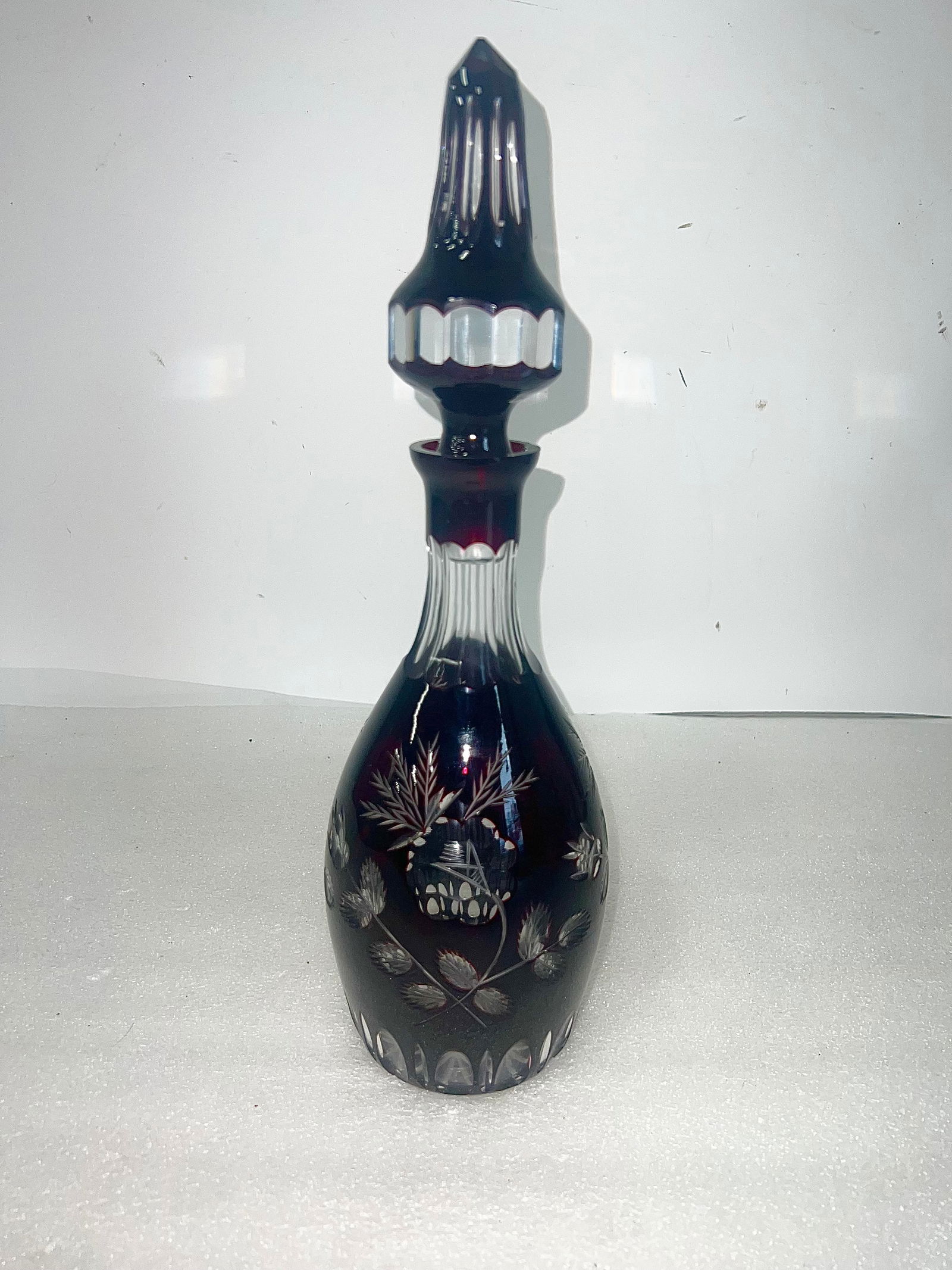 Cranberry to Clear Antique Decanter: As pictured Cranberry a "cut-to-clear" style, featuring intricate hand-cut floral or vine designs. 14.75”H