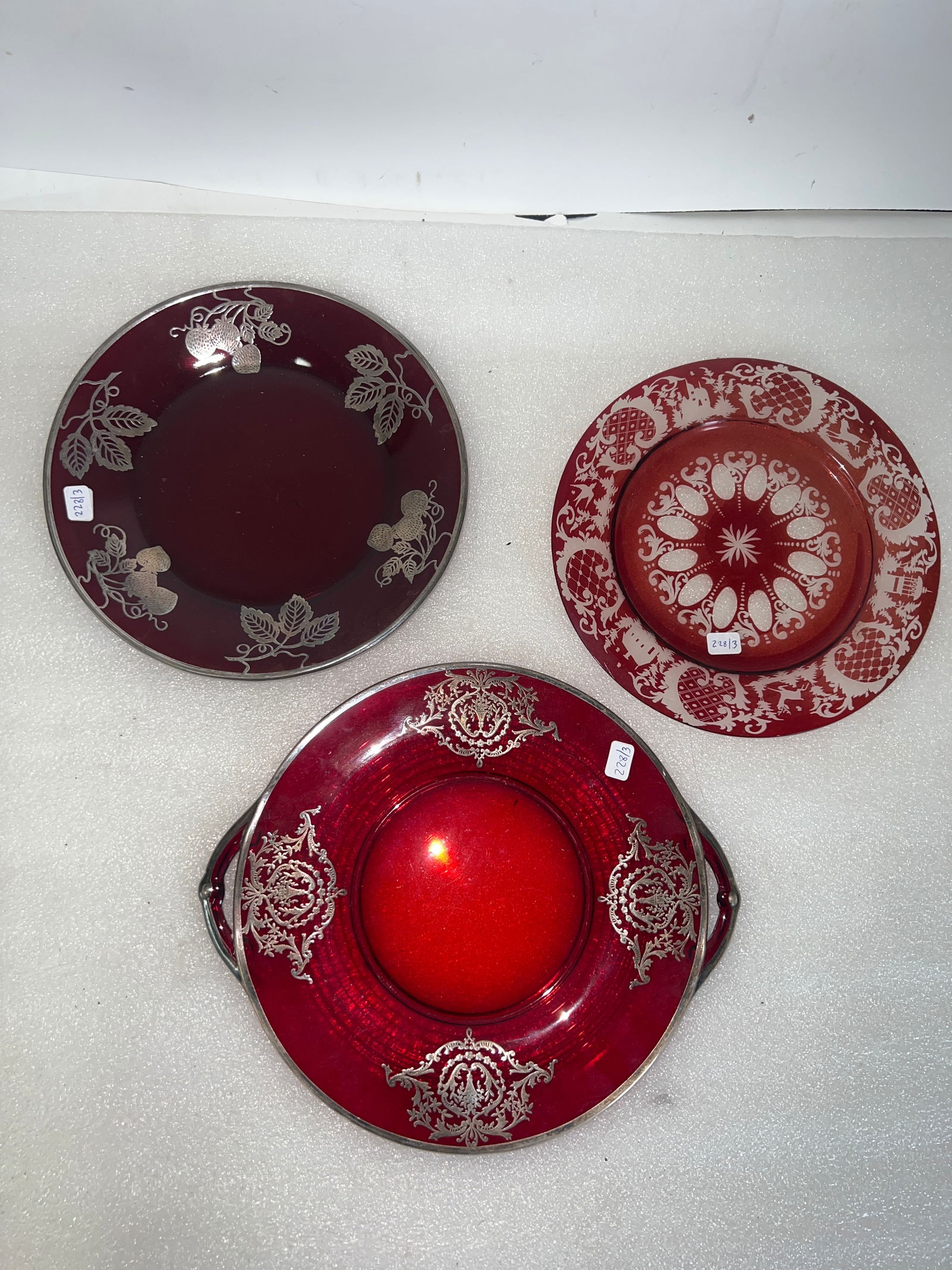 Collectible Lot of Cranberry Glass (3): Two with silver overlay and with with etched decorations. Three in the lot. 11 1/4" Double handled platter to 8 3/4"