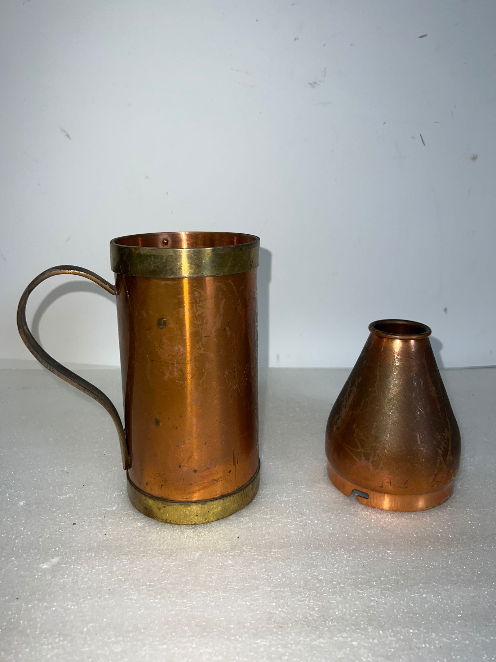 Antique Copper Litre Container & Copper Shade (2): 8"H and 4"H Handled Mug Container with brass rim top and bottom.