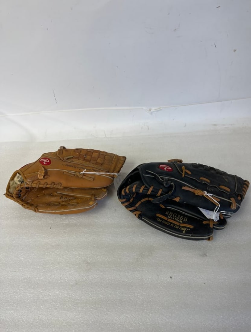 2 Baseball Gloves "Hardball" Sgd Derek Jeter: made by Rawlings Tan Color, the Other is RBG36B 12 1/2" Color black made by Rawlings