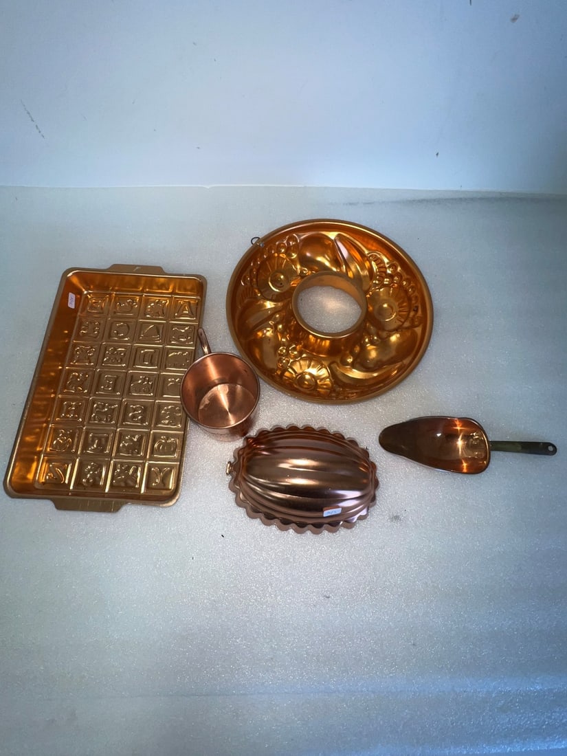 A Dealer or Collector's Lot of Copper (5): Two molds; a scoop, a cup and baking pan Five pcs. in the lot. The cup embossed United by Blue and marked across cup and at the underside. Hand Welded. Varyng sizes as pictured. 12"L (pan) to 4"H (cup