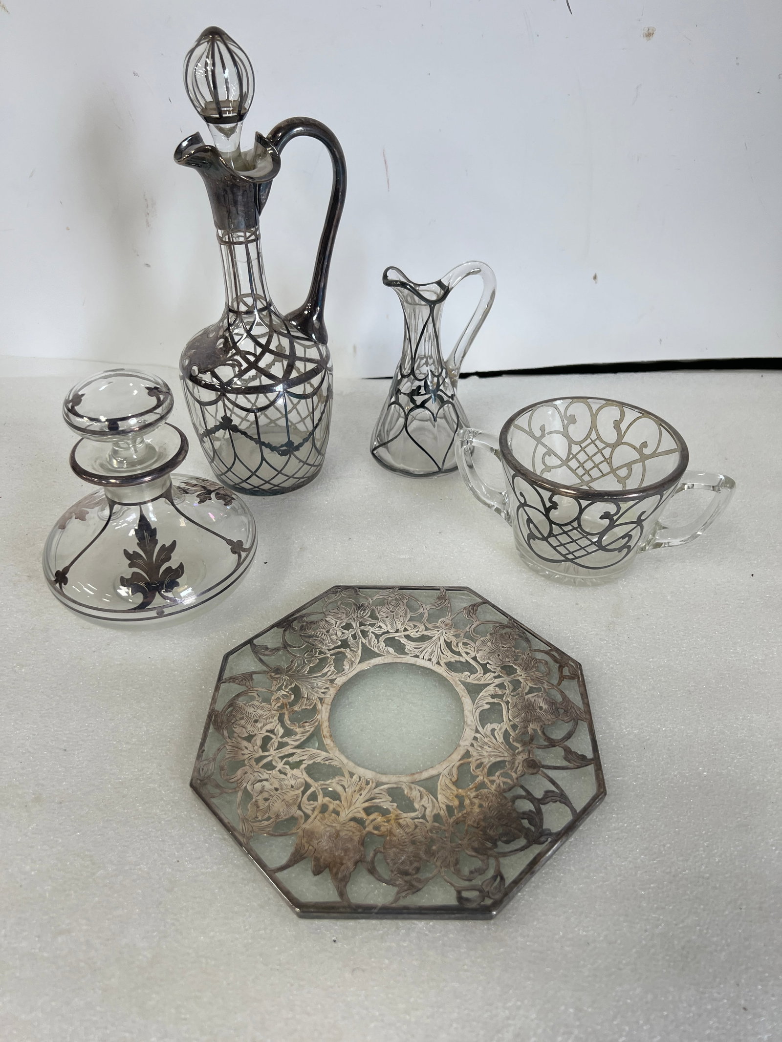 Sterling Silver on Glass Antiques (5): Cruet, perfume, stoppered decanter, tile and double handled sugar. 10"H to 2 3/4"H Five items in the lot