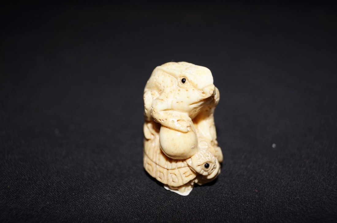 Marine Ivory Frog on Turtle netsuke: Carved netsuke; 1.75in. H.